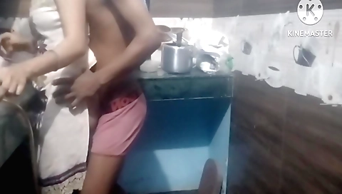 Indian girl sucks her neighbor's stepdad in the kitchen