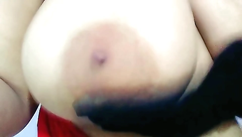 Indian solo female in a red bra is wearing big fat tits