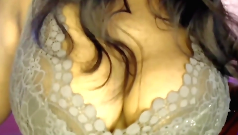 Brunette in a sexy dress is playing with her pussy