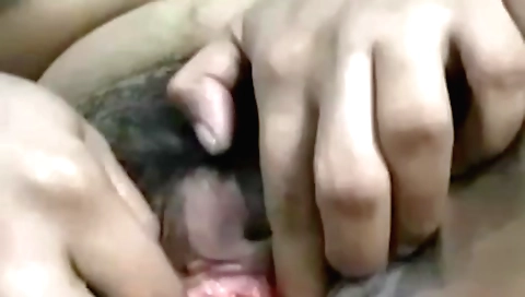 Stunning brunette with a hot body is fingering a dildo