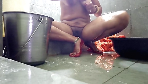 Bharati in her open bath is having fun with her partner