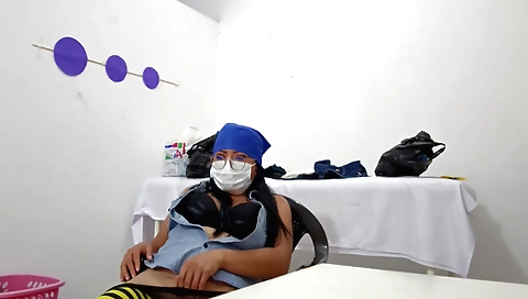 Sweet nurse is showing off and masturbating at the camera