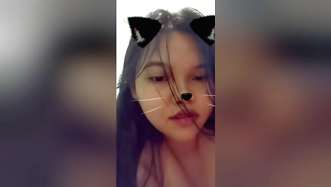 Brunette in black shorts and a blouse in the woods