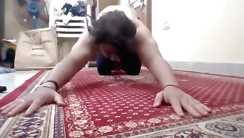 Indian girl stretching her body during a solo workout