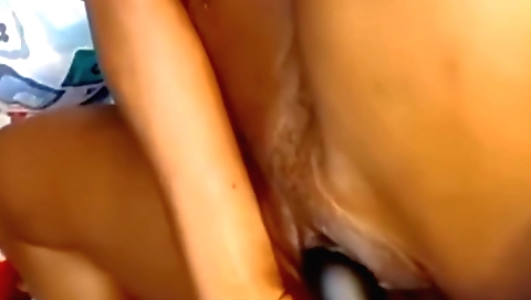 Indian solo girl with a big black dildo in her vagina