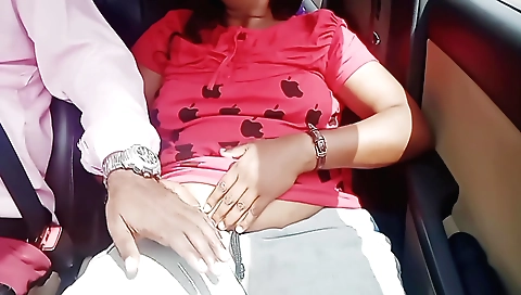 Indian brunette with a sexy body riding a car in the street