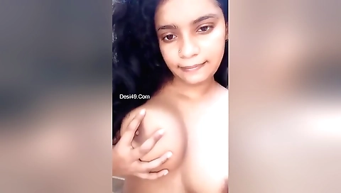 Sexy indian girl in a sexy dress and her big tits show off