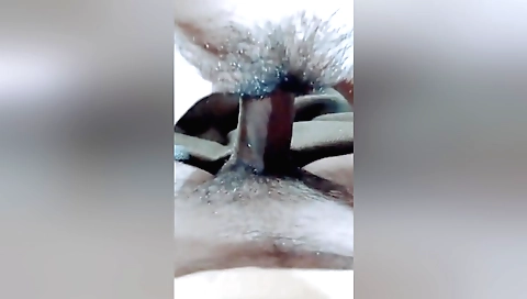 Indian woman with hairy pussy on the bed sucking a dick