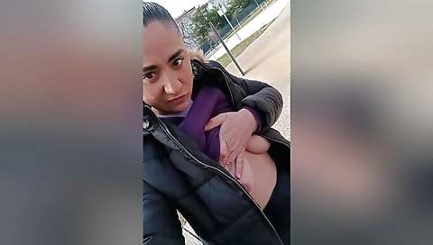 Brunette amateur in a swimsuit is doing outdoor action