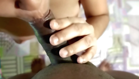 A girl in a sexy dress sucks a cock and gets her pussy wet