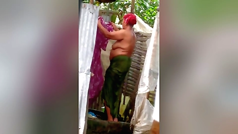 Sexy mature indian aunt enjoying the sun in backyard