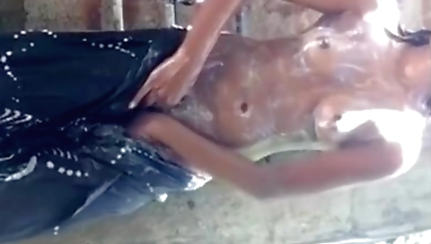 A skinny brunette enjoying a hot shower on a webcam